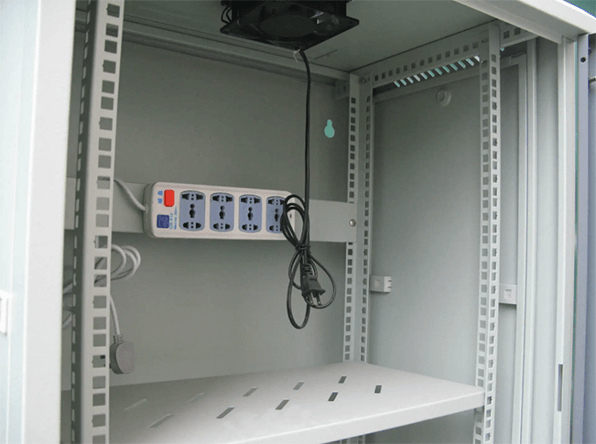 a cooling fan installed in the top of the empty cabinet